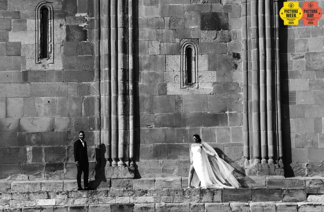 couple ancient georgian church stone facade bw wedding — GOGA Photography