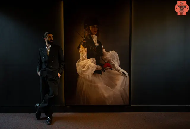 groom beside bridal portrait dark moody venue — GOGA Photography