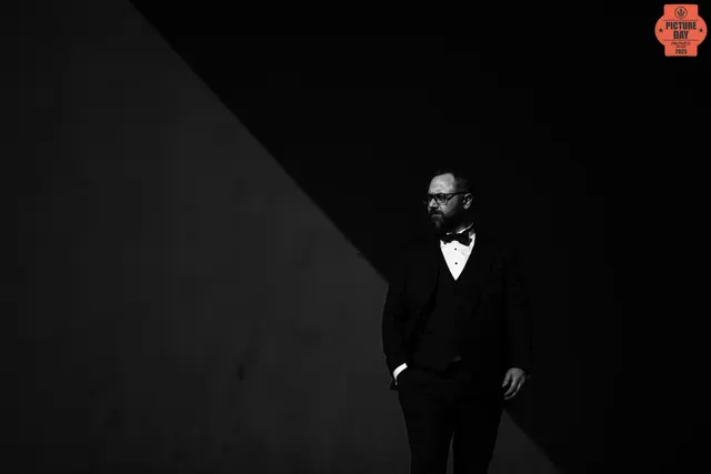 groom bow tie tuxedo diagonal light shadow bw — GOGA Photography