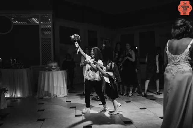 child catches bouquet toss wedding reception georgia — GOGA Photography